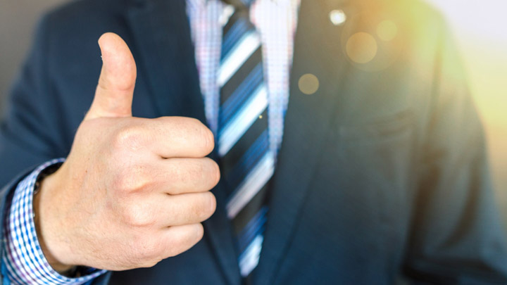businessman giving thumbs up