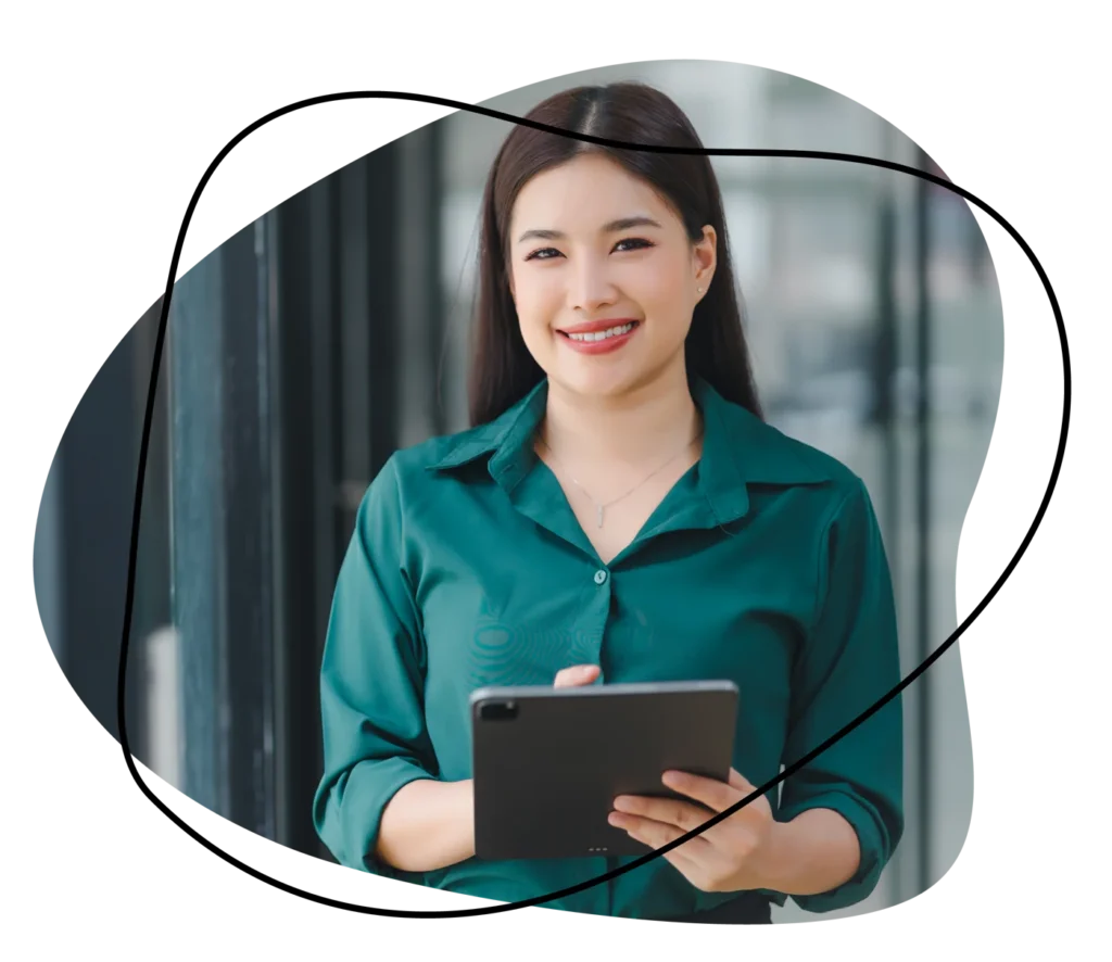 Smiling professional holding a tablet, representing recruitment in sales and marketing.